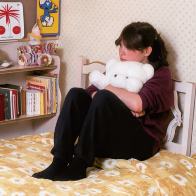 girl huggin bear